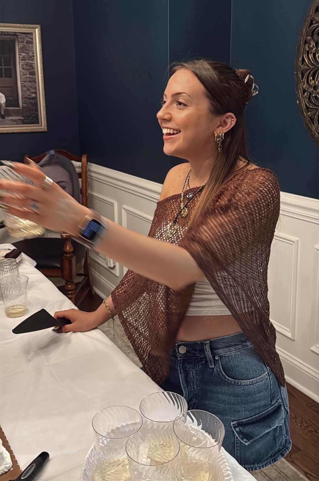 Josie smiling at a table